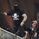 Illustration for article titled Police Find Serbia’s Infamous Masked Hooligan Hiding In Bus Luggage Compartment
